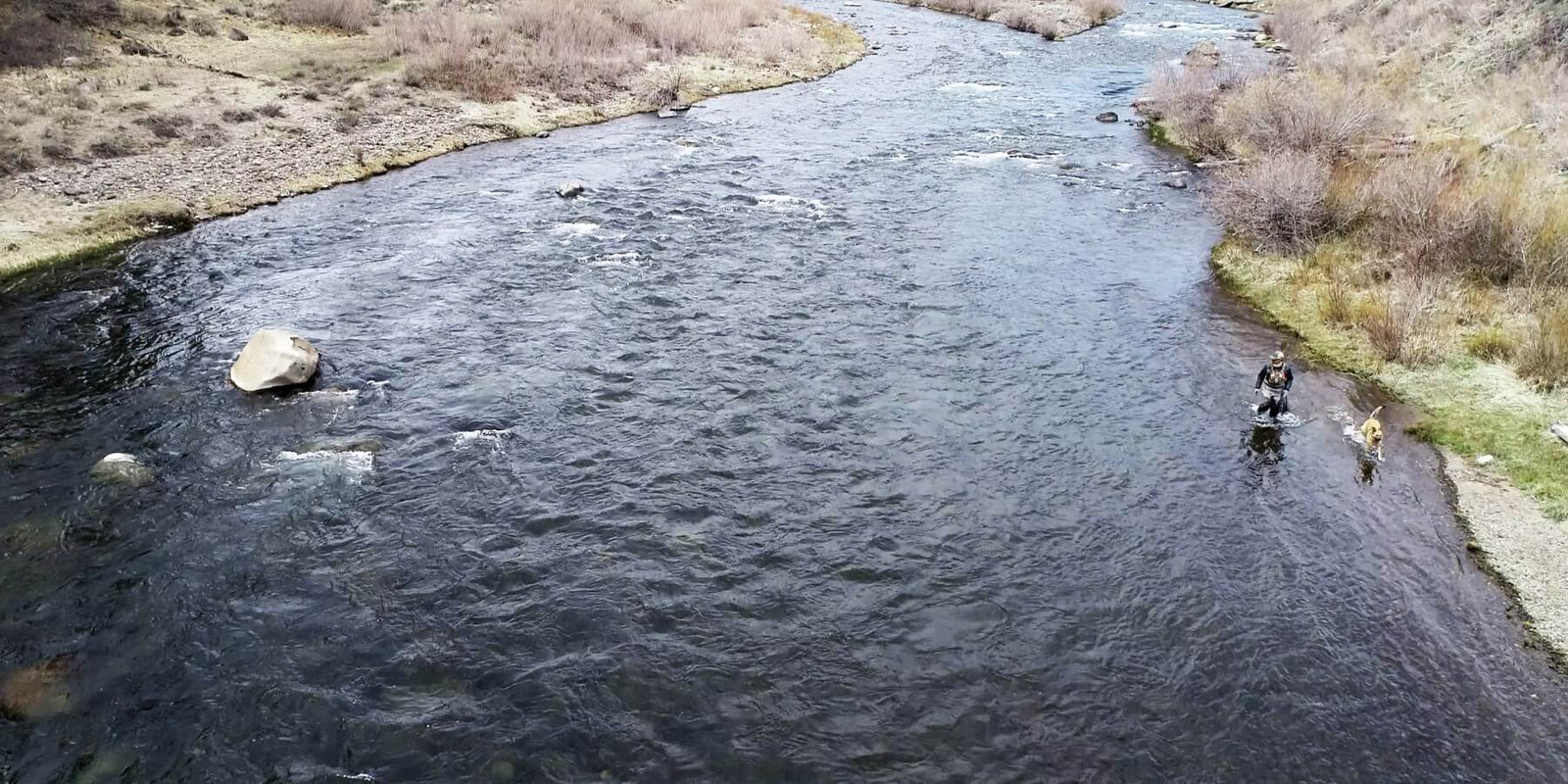 Flyfishing in a river in Truckee drone shot